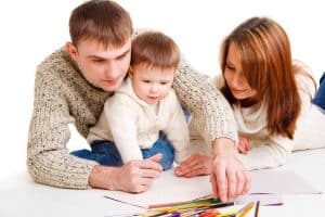 parents with child drawing